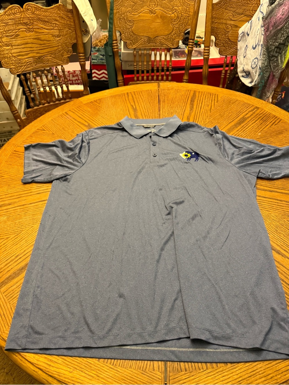 Trimark Men's Heather Blue Polo Shirt with Embroidered Buffalo Sun Logo